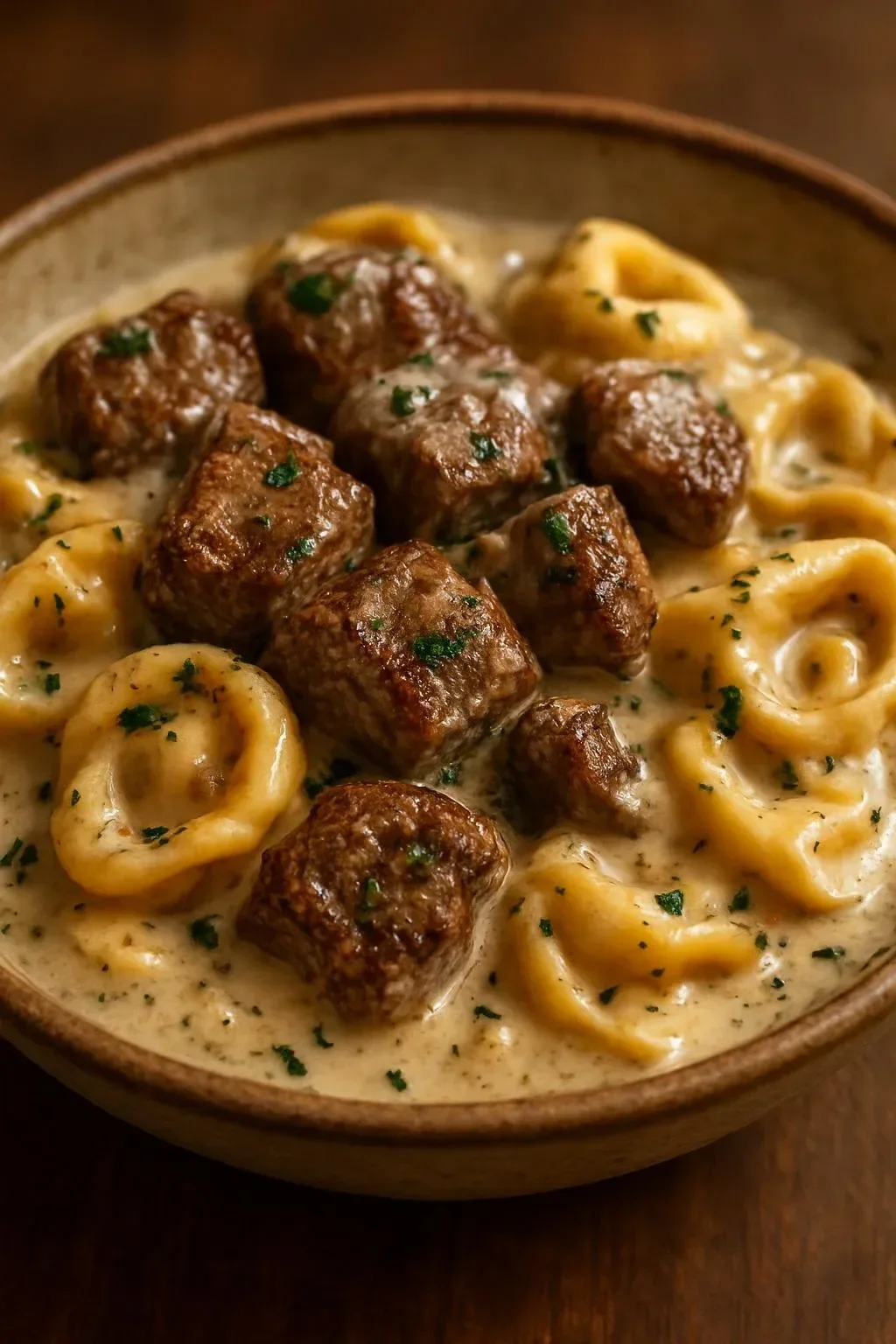 Delicious Garlic Steak Tortellini in Creamhouse Sauce served in a bowl.